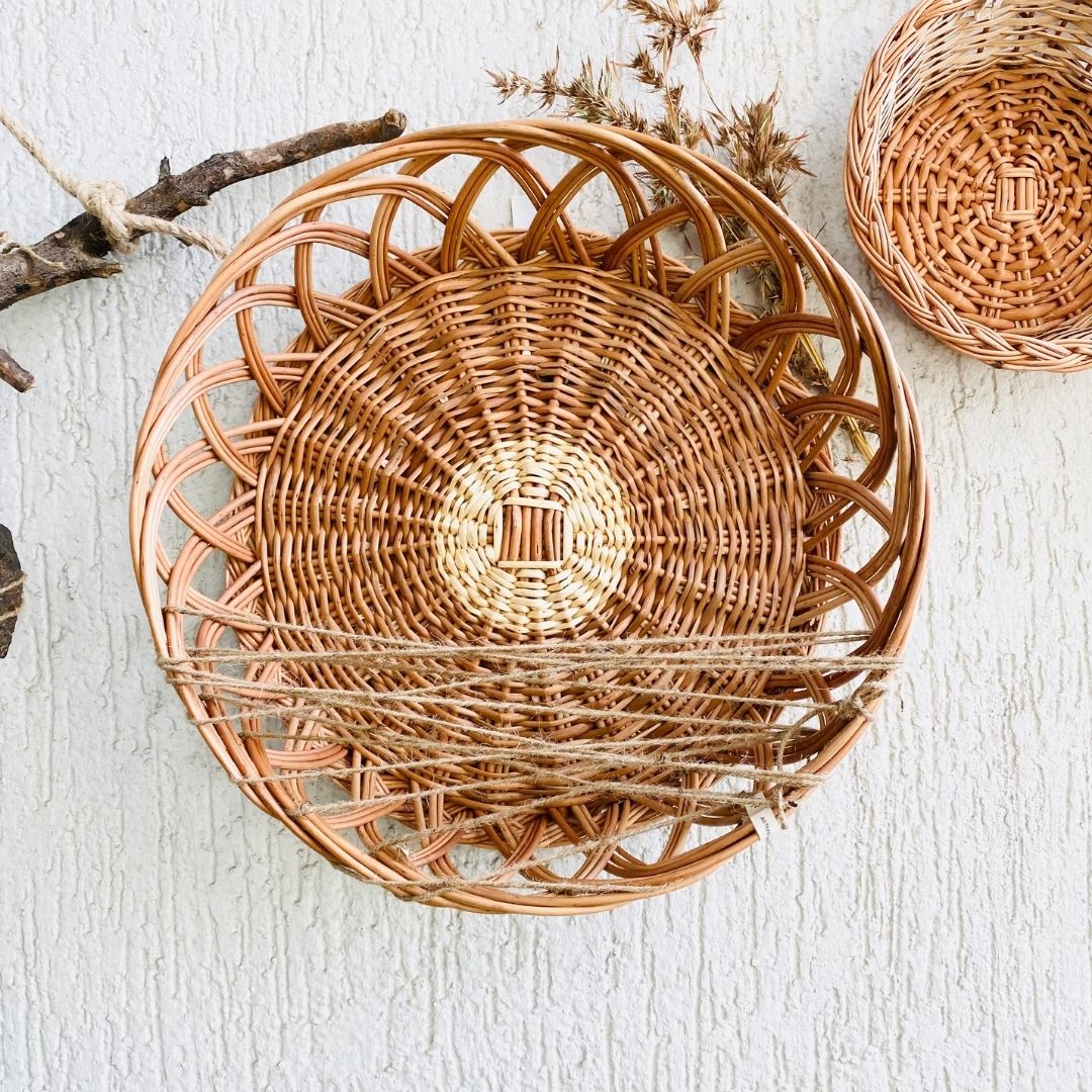 Crown wicker basket used in wall basket arrangement.