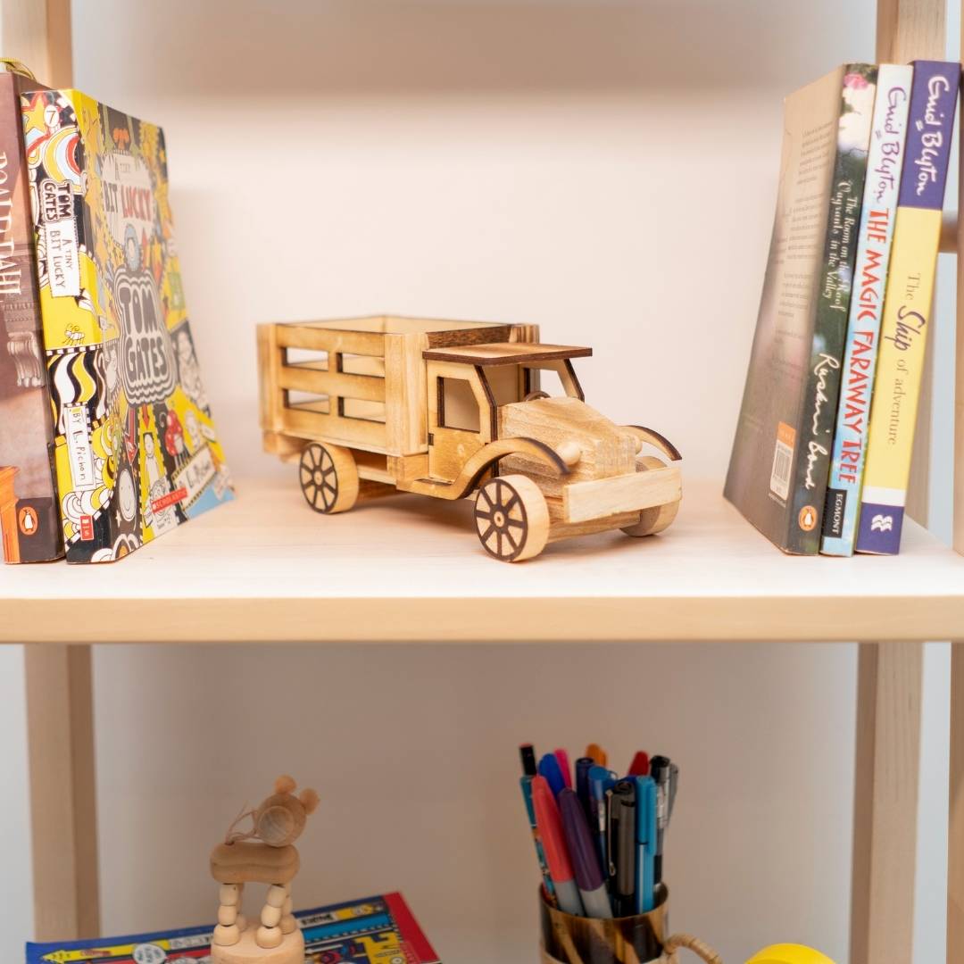 DaisyLife's natural wooden truck with books in background