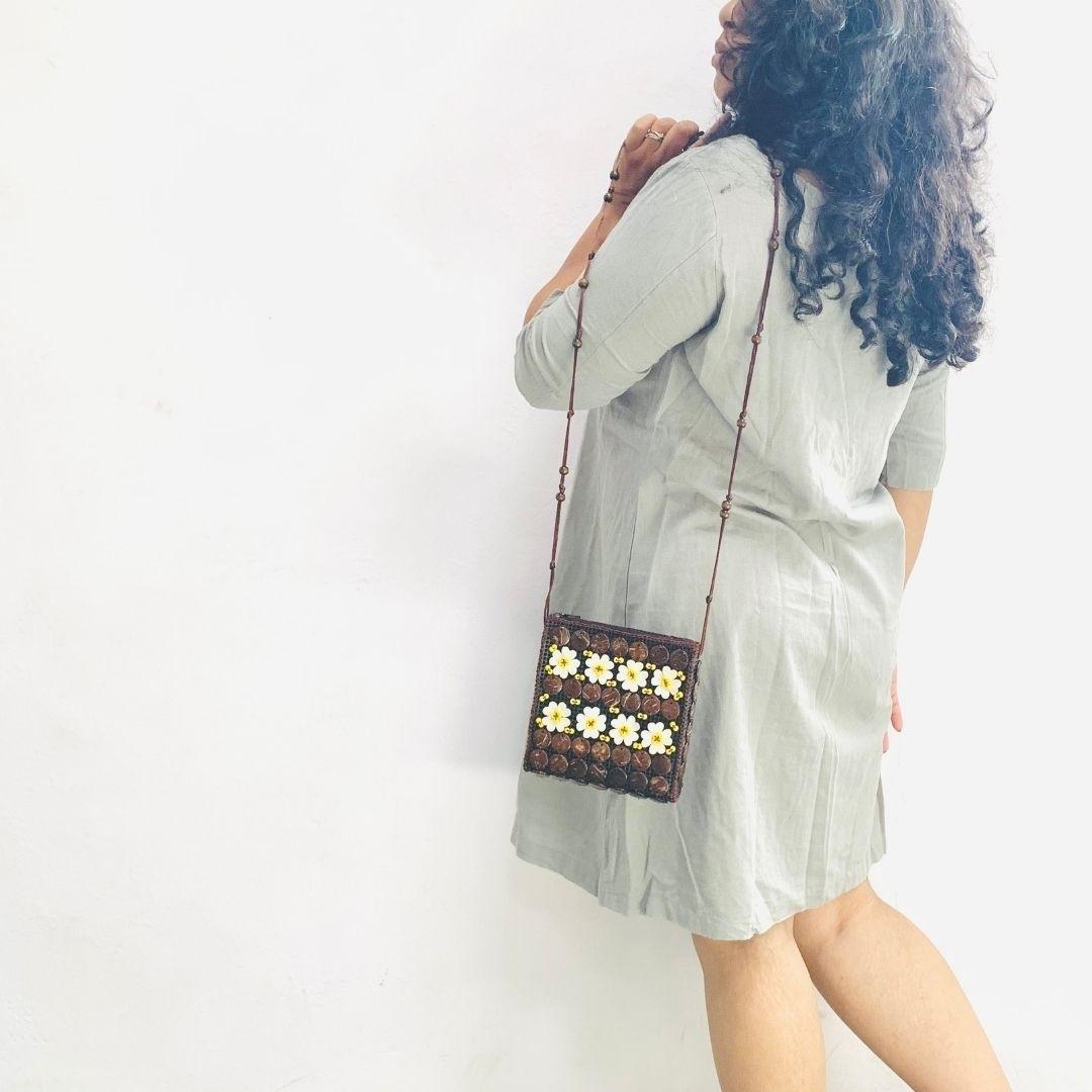 A girl carrying a neat flat passport shape in a sling to carry around easily or pack in travel bag. 