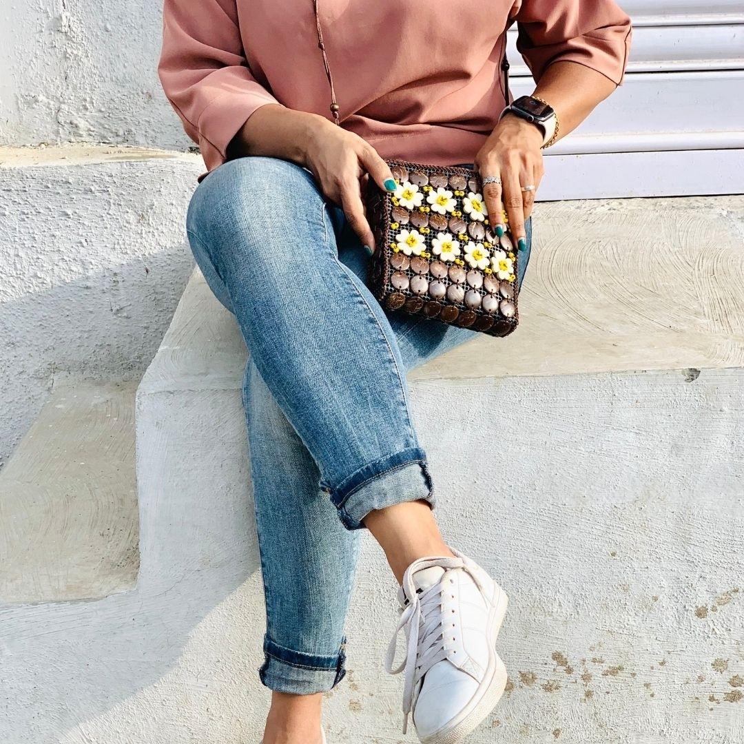 A girl carrying a neat flat passport shape in a sling to carry around easily or pack in travel bag