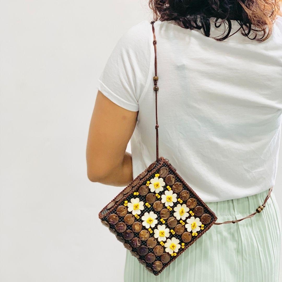 A girl carrying a neat flat passport shape in a sling to carry around easily or pack in travel bag