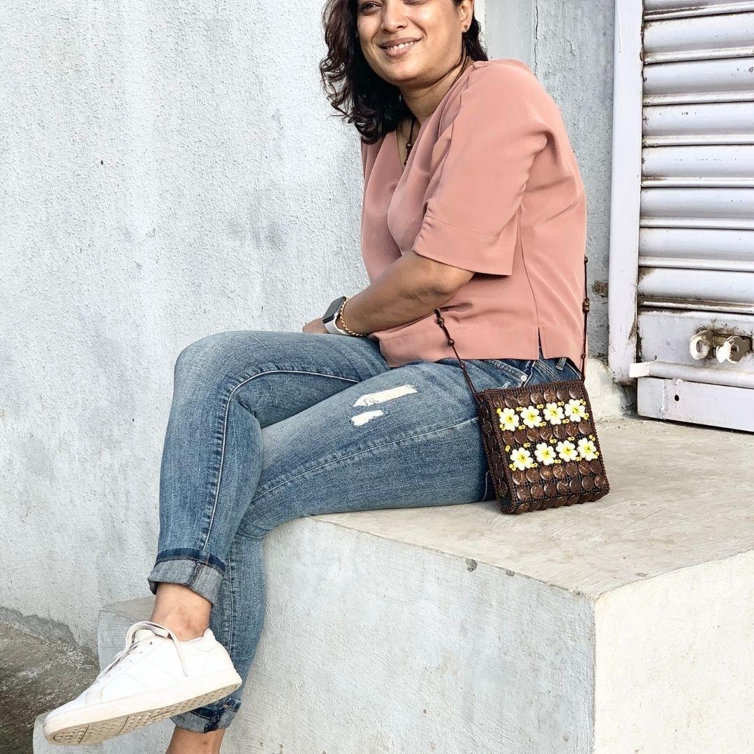 A girl carrying a neat flat passport shape in a sling to carry around easily or pack in travel bag