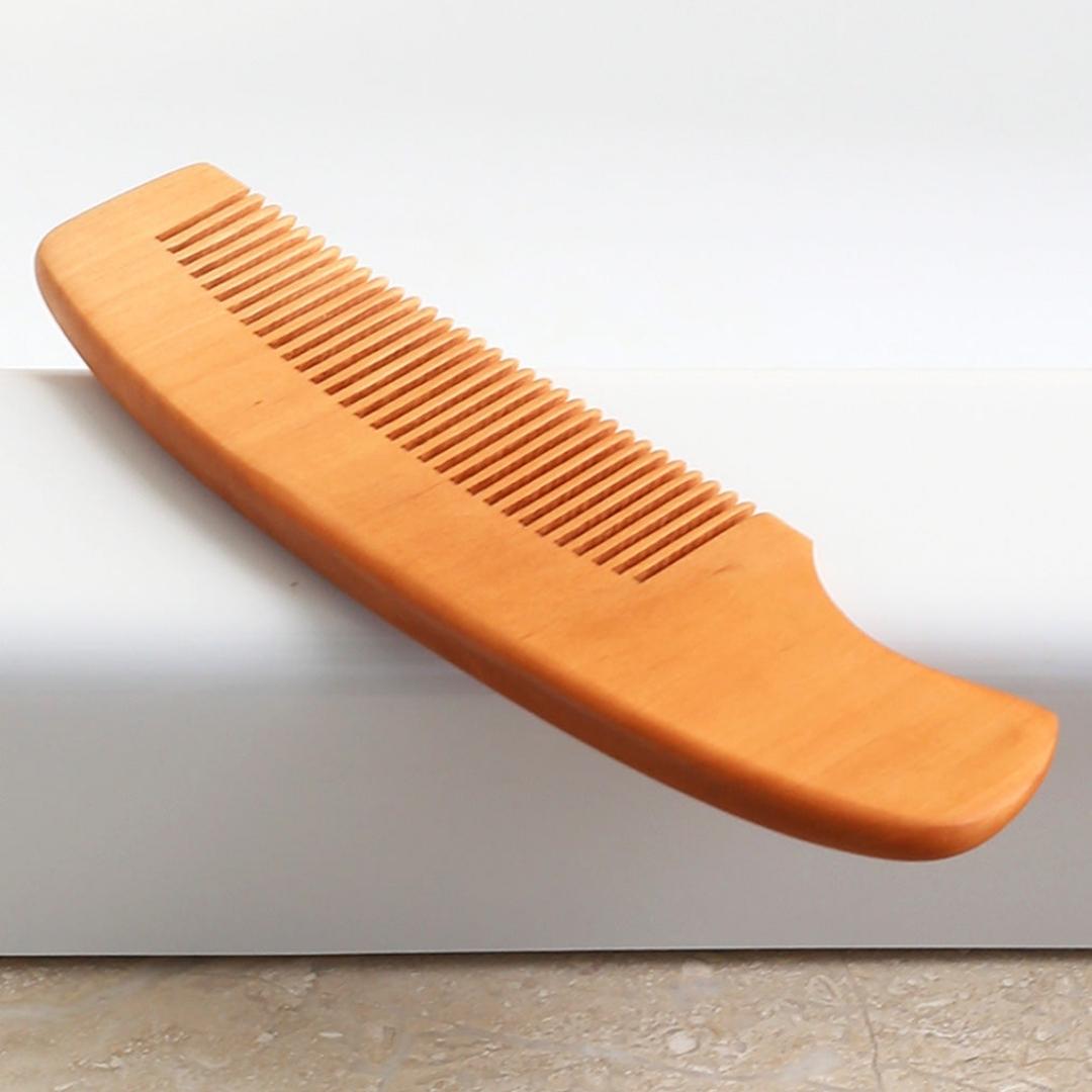 Light wood comb with pretty flower engraving in two different styles