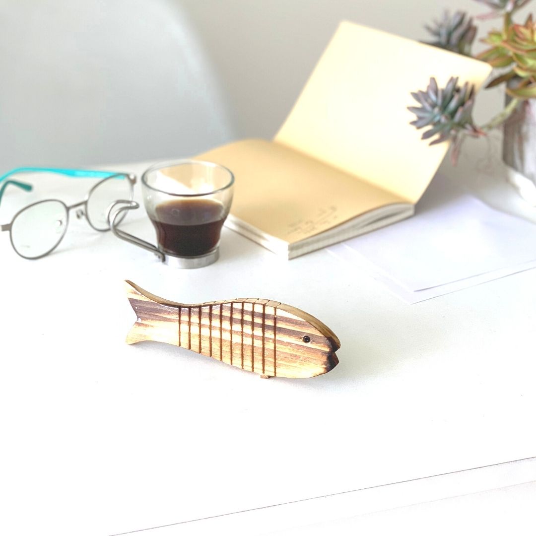  Flat Wooden Fish toy on office table 