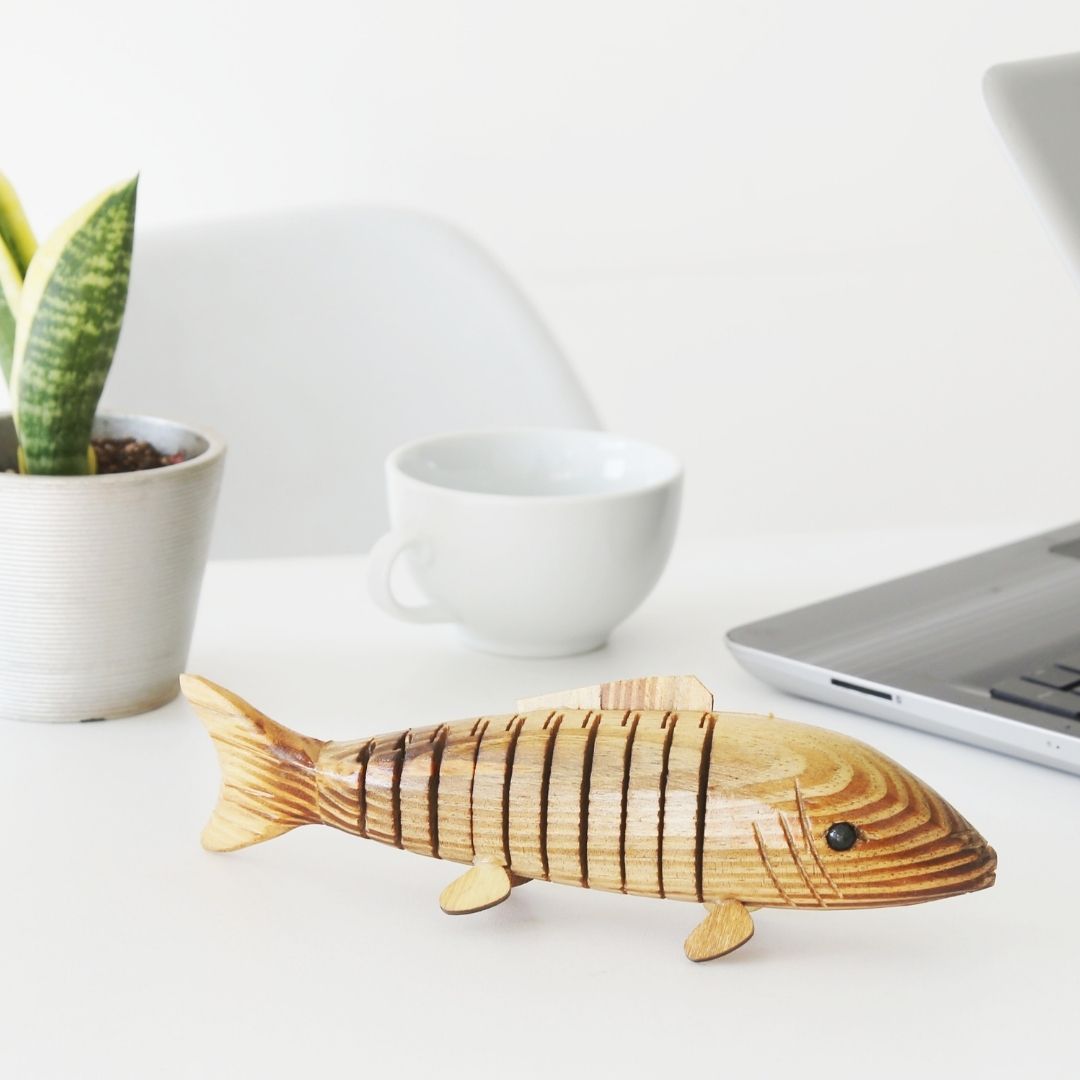 Natural and Eco-friendly Natural Wooden fish kept on office table