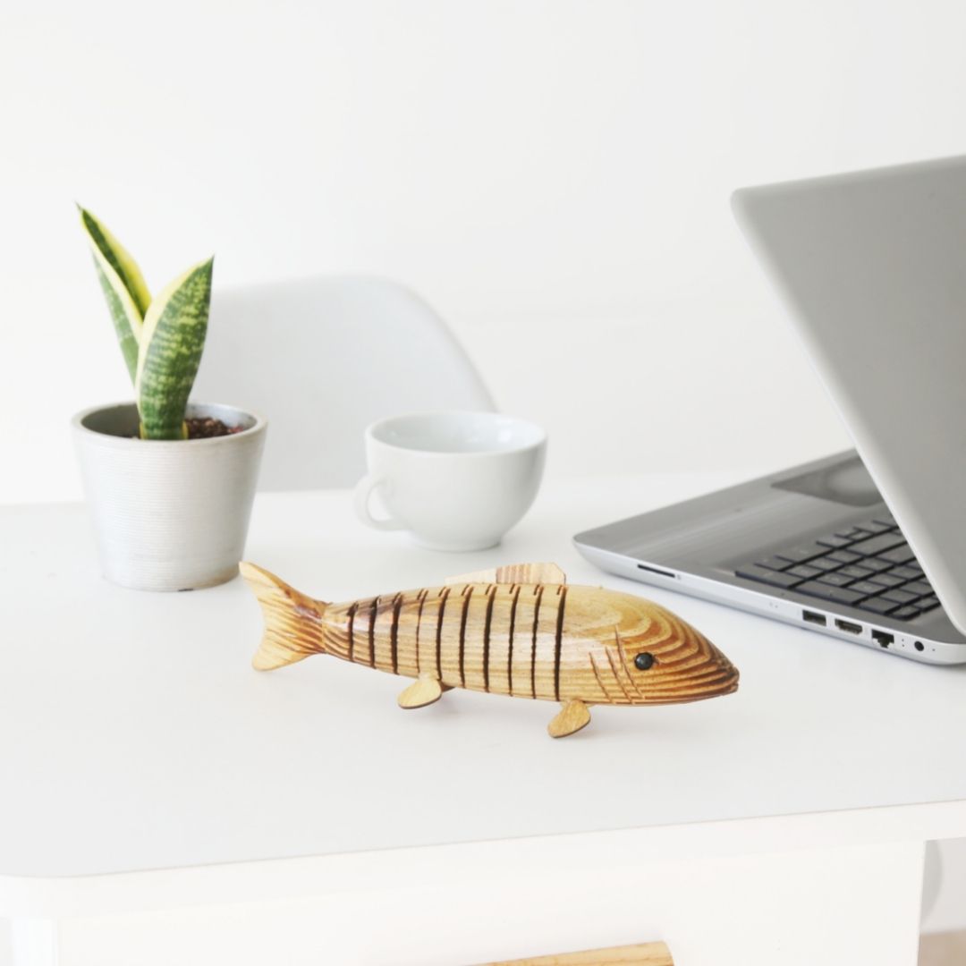 Natural and Eco-friendly Natural Wooden fish kept on office table