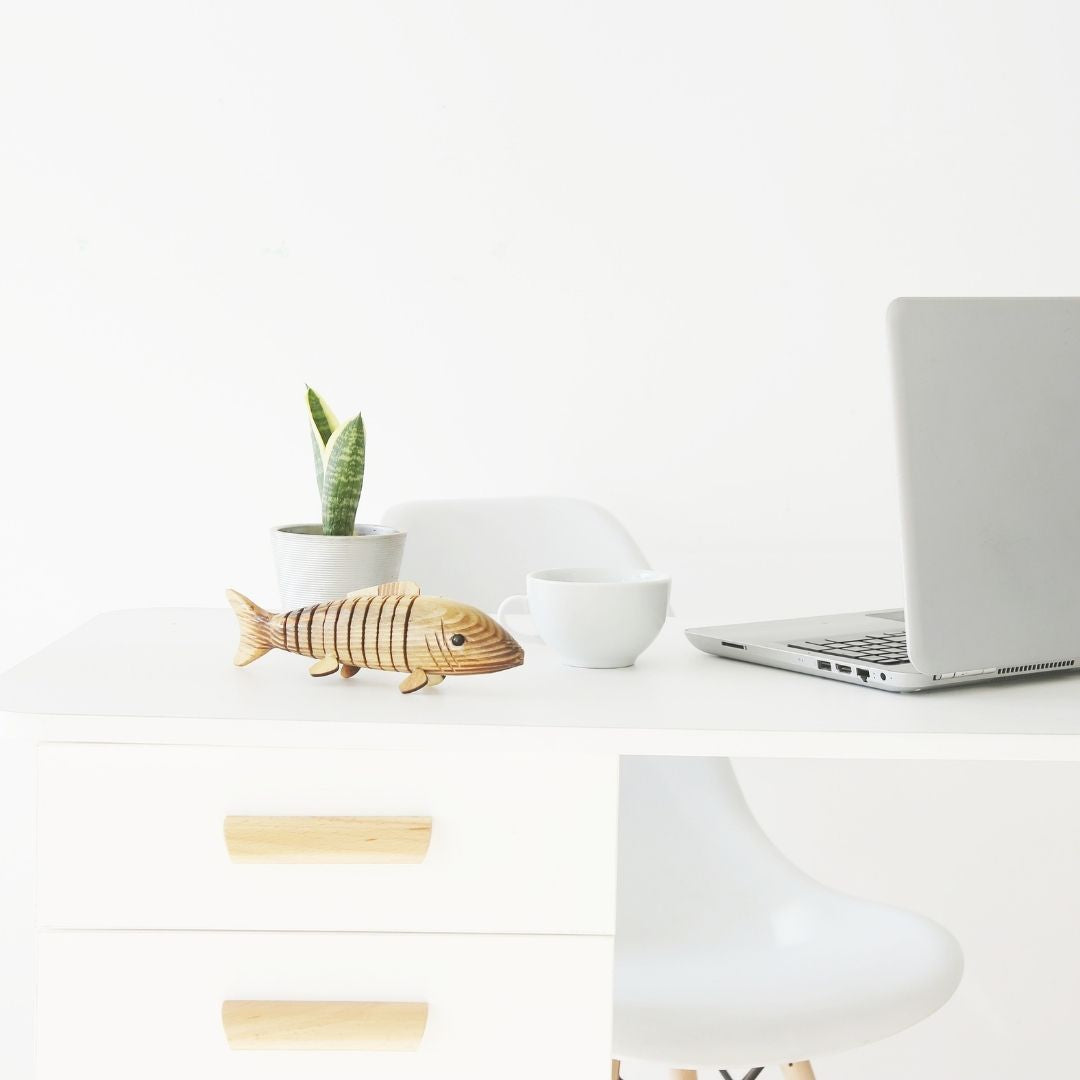 Natural and Eco-friendly Natural Wooden fish kept on office table