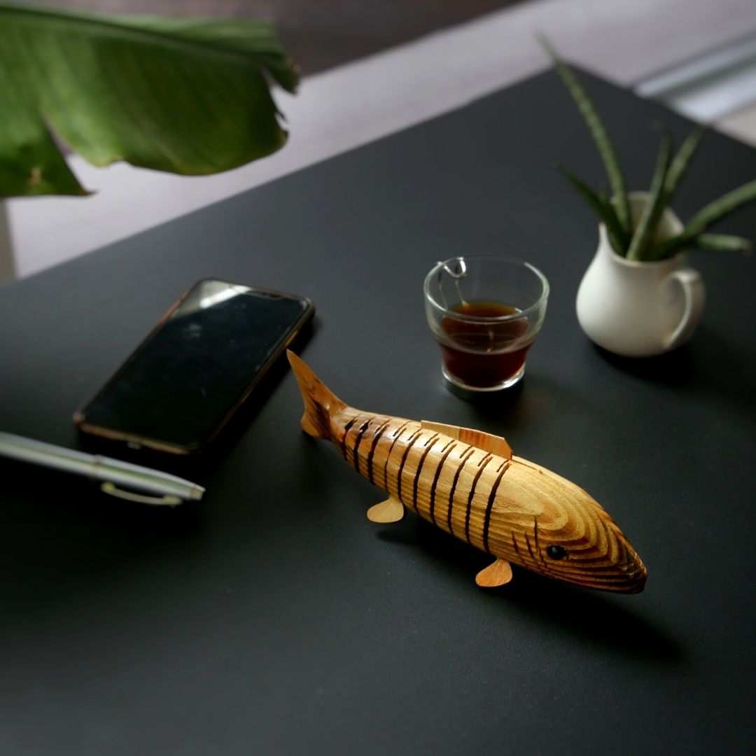 Natural and Eco-friendly Natural Wooden fish kept on office table