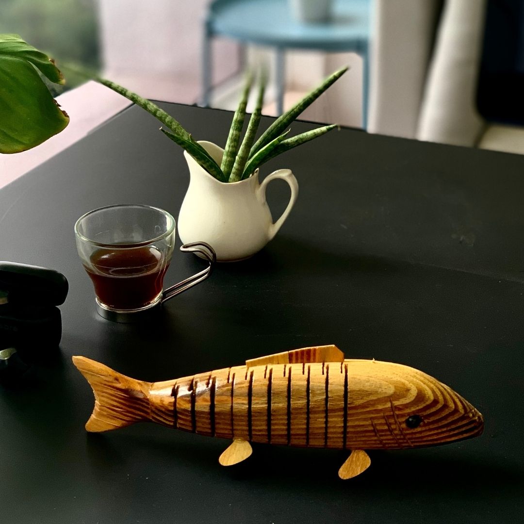 Natural and Eco-friendly Natural Wooden fish kept on office table