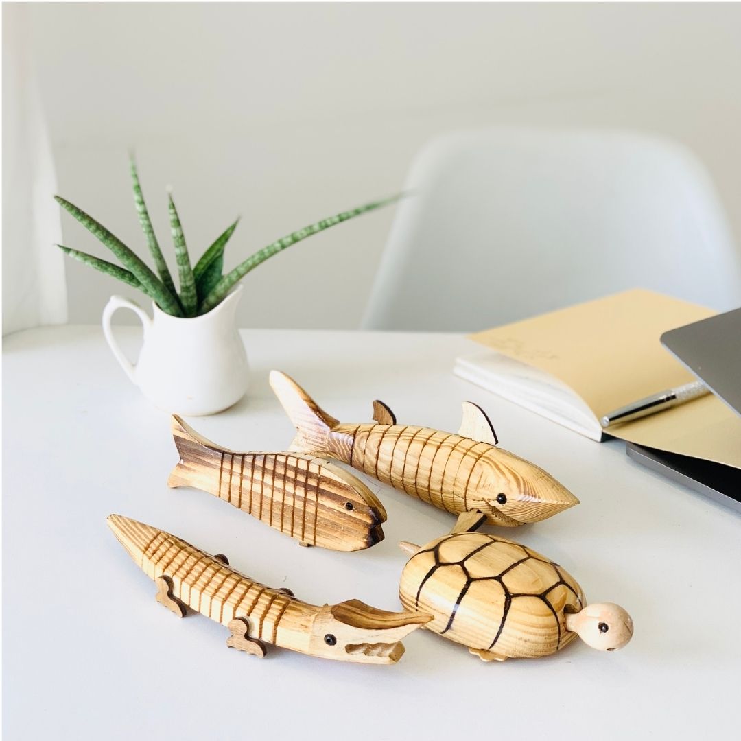 Wooden shark kept on the table as office room decor