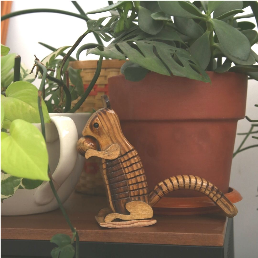 DaisyLife "Skippy" Wooden Squirrel with Chestnut , plants are kept in background