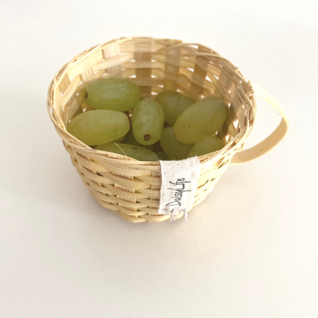 Grapes kept inside bamboo tea shaped cup
