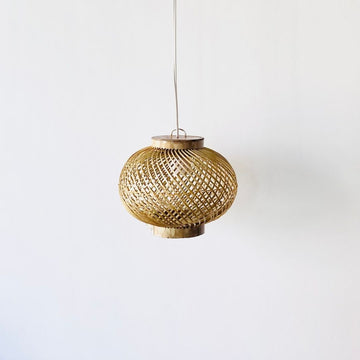 Finely woven natural bamboo lampshade.