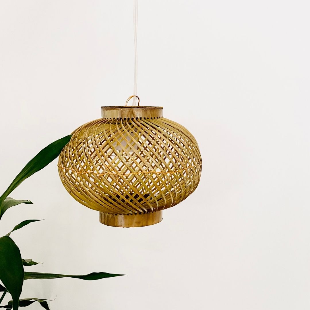 Leaves behind Finely woven natural bamboo lampshade.