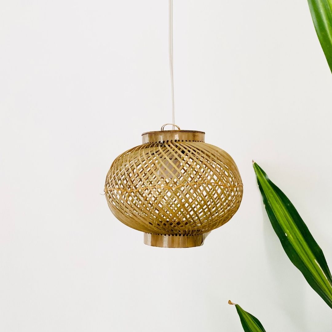 Leaves behind Finely woven natural bamboo lampshade.